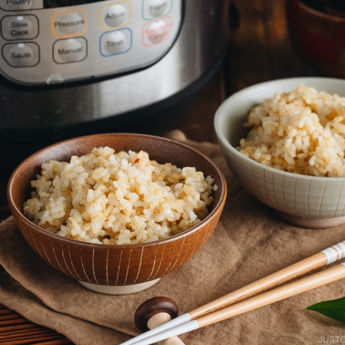 Rice bowls containing perfectly cooked short grain brown rice.