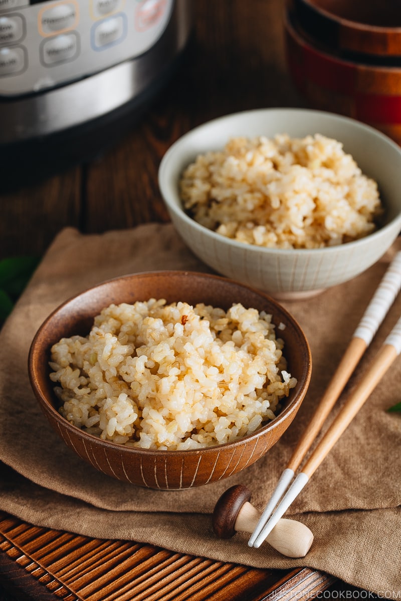 Rice bowls containing perfectly cooked short grain brown rice.