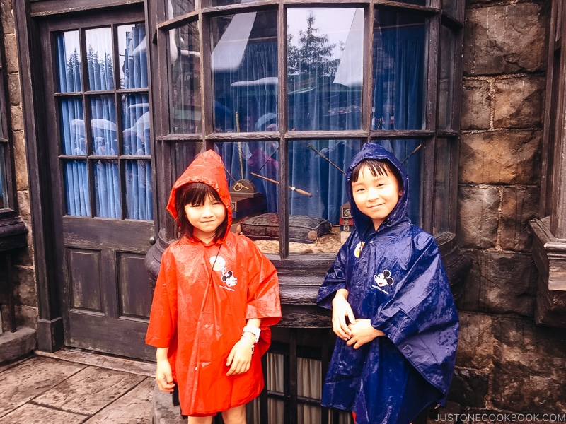 children in front of wands inside a window at the Wizarding World of Harry Potter - Osaka Guide: Universal Studios Japan | www.justonecookbook.com