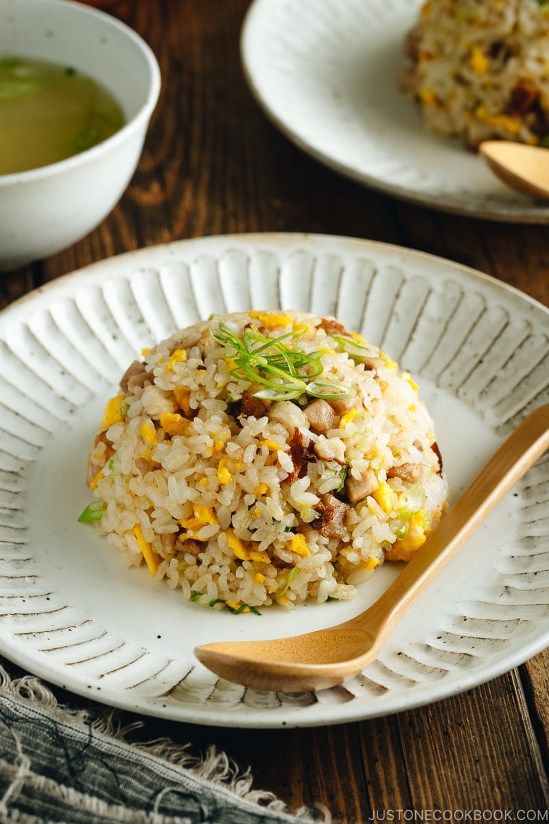 Chashu fried rice on white plates.
