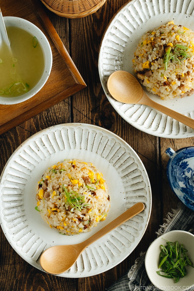 Chashu fried rice on white plates.