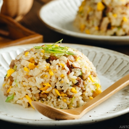 Chashu fried rice served on white plates.