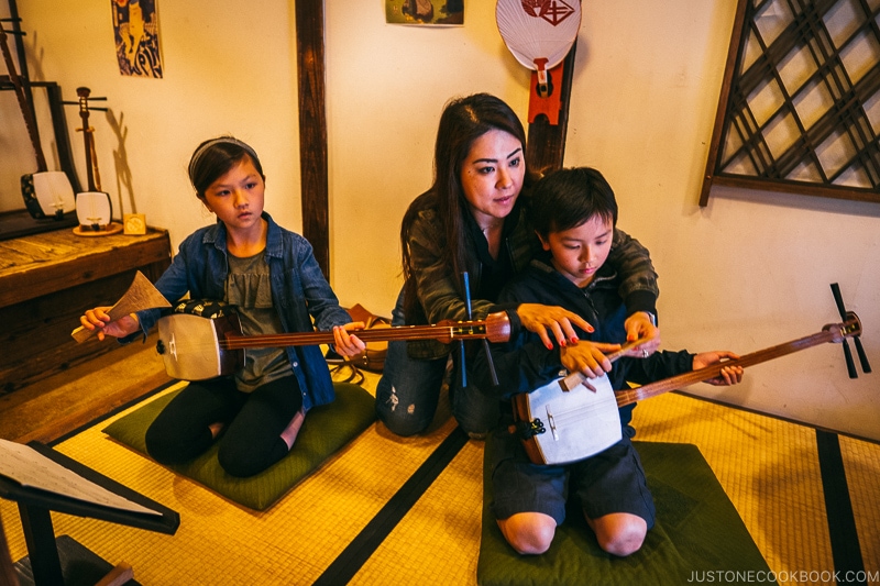 children playing Shamisen three strings - Nikko Travel Guide : Edo Wonderland Nikko Edomura | www.justonecookbook.com