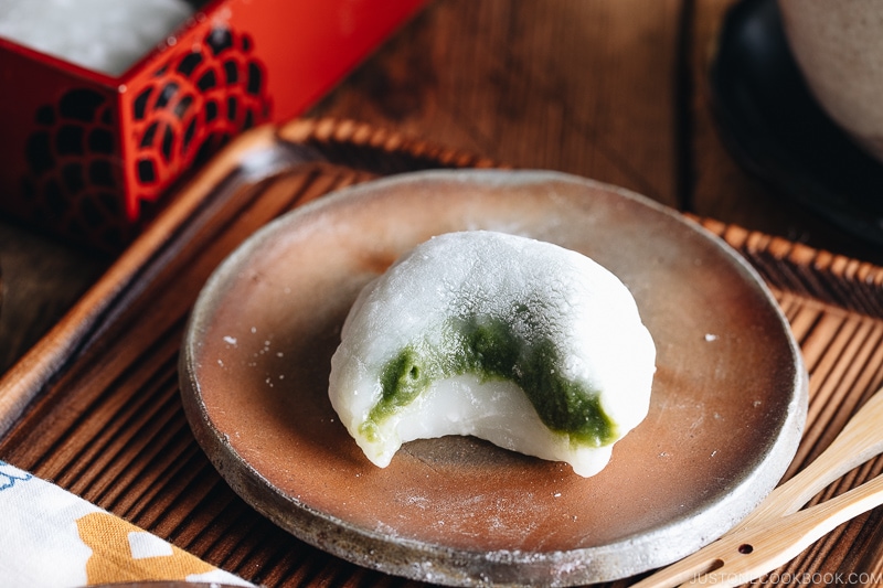 Green tea mochi showing sweet matcha filling.