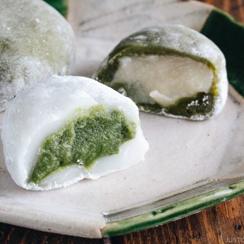 Green tea mochi showing green filling and white filling.