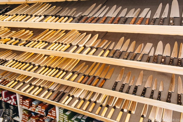 Japanese knives on a shelf.