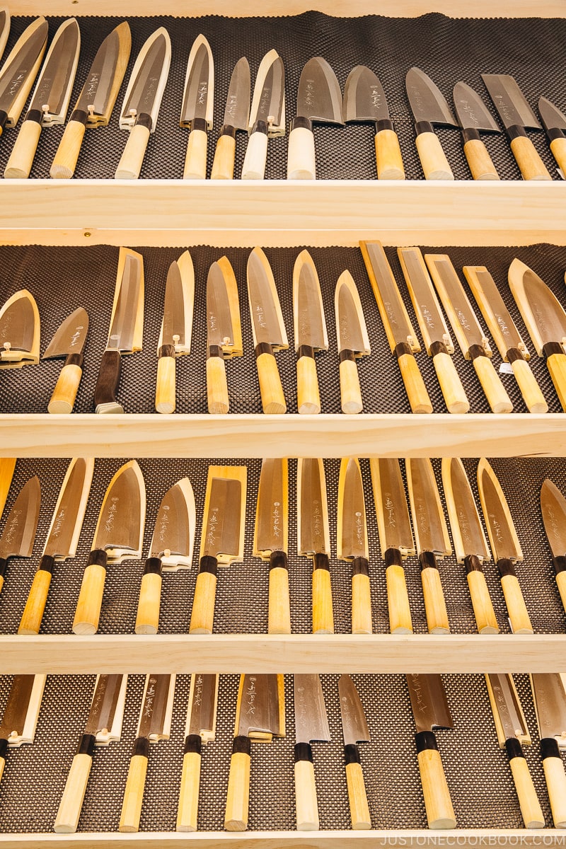 Kikuichi knives displayed on a shelf - Your Guide to Japanese Knives | www.justonecookbook.com