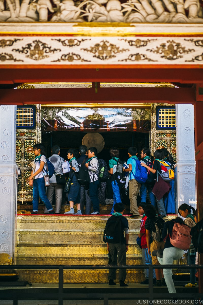 visitors walking past the main shrine - Nikko Travel Guide : Nikko Toshogu Shrine | www.justonecookbook.com