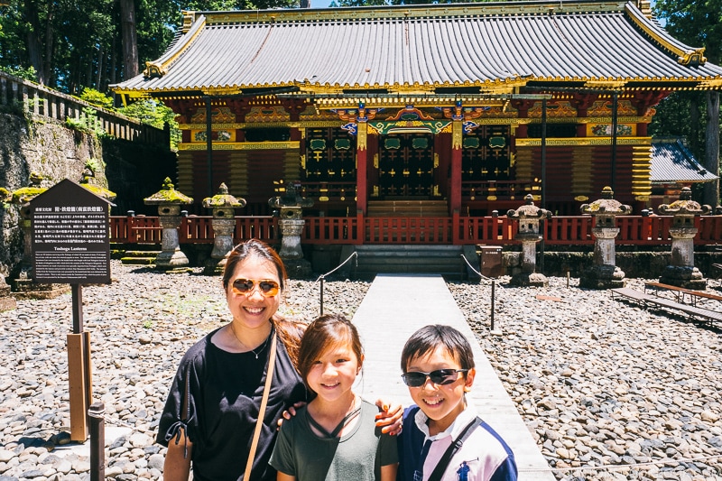 family in front of stone lanterns - Nikko Travel Guide : Nikko Toshogu Shrine | www.justonecookbook.com