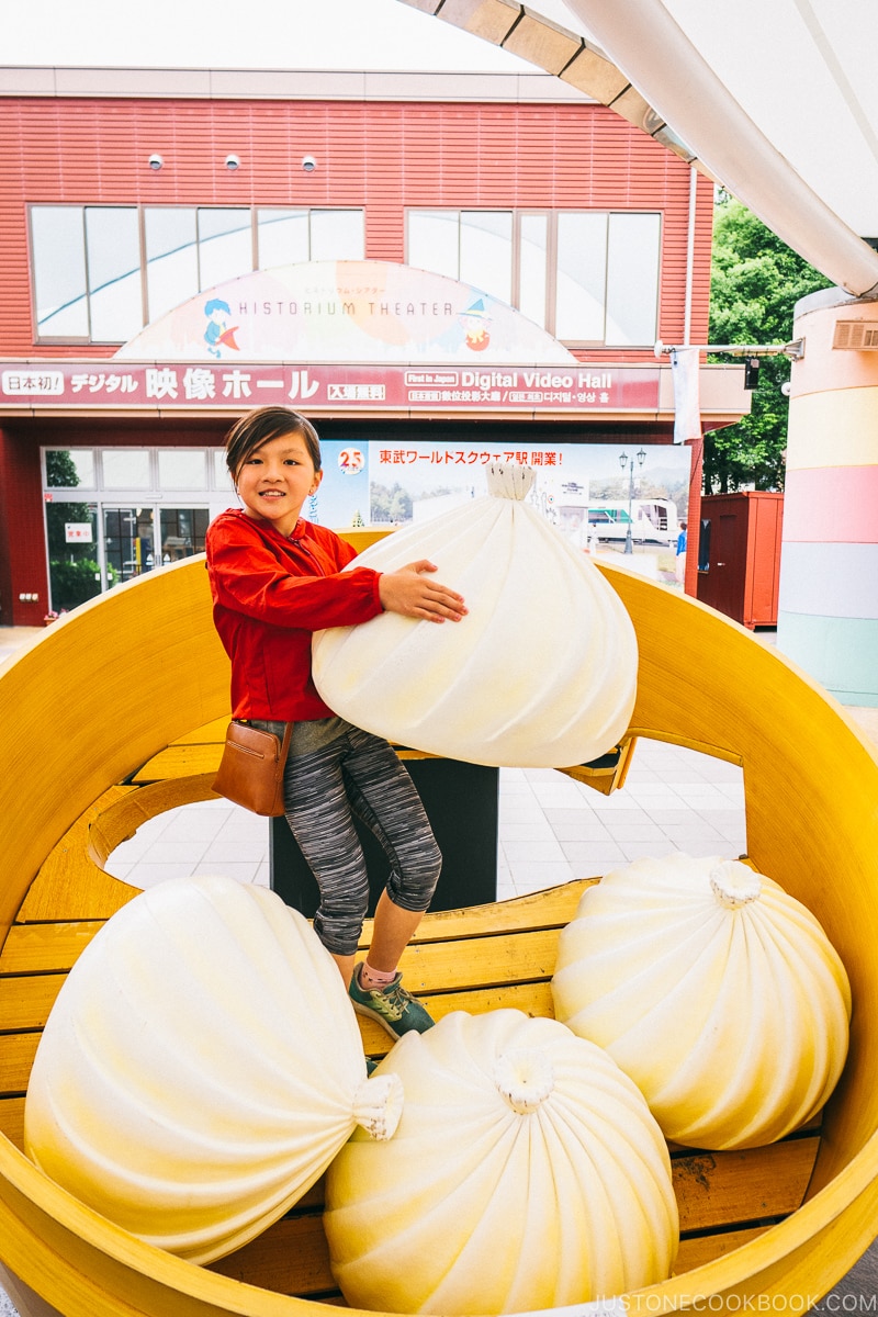 child inside giant steamed basket with dumpling - Nikko Travel Guide : Tobu World Square | www.justonecookbook.com