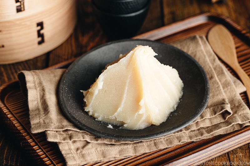 White bean paste on a Japanese black plate.