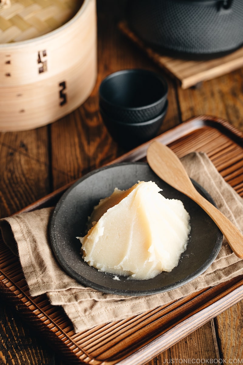 White bean paste on a Japanese black plate.