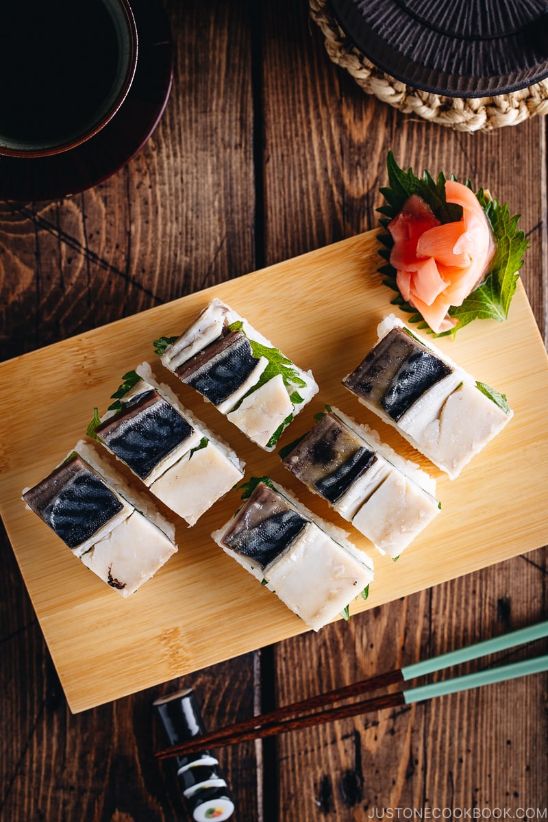 Mackerel Pressed Sushi (Saba Oshizushi) and sushi ginger are on the bamboo sushi tray.