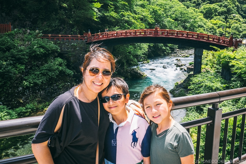 family standing in front of Shinkyo Bridge - Places to Visit and Things to do in Nikko | www.justonecookbook.com