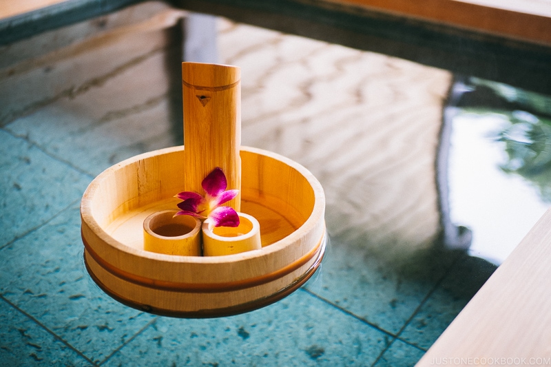 Sake set floating on top of onsen tub at Okunoin Hotel Tokugawa - Places to Visit and Things to do in Nikko | www.justonecookbook.com