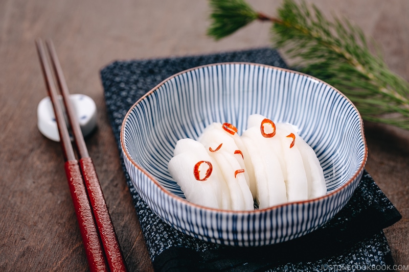 Japanese Pickled Daikon in a Japanese blue ceramic bowl.