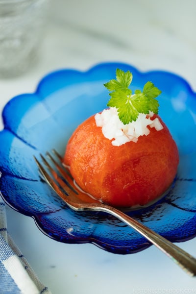 Pickled Tomatoes on a blue plate.