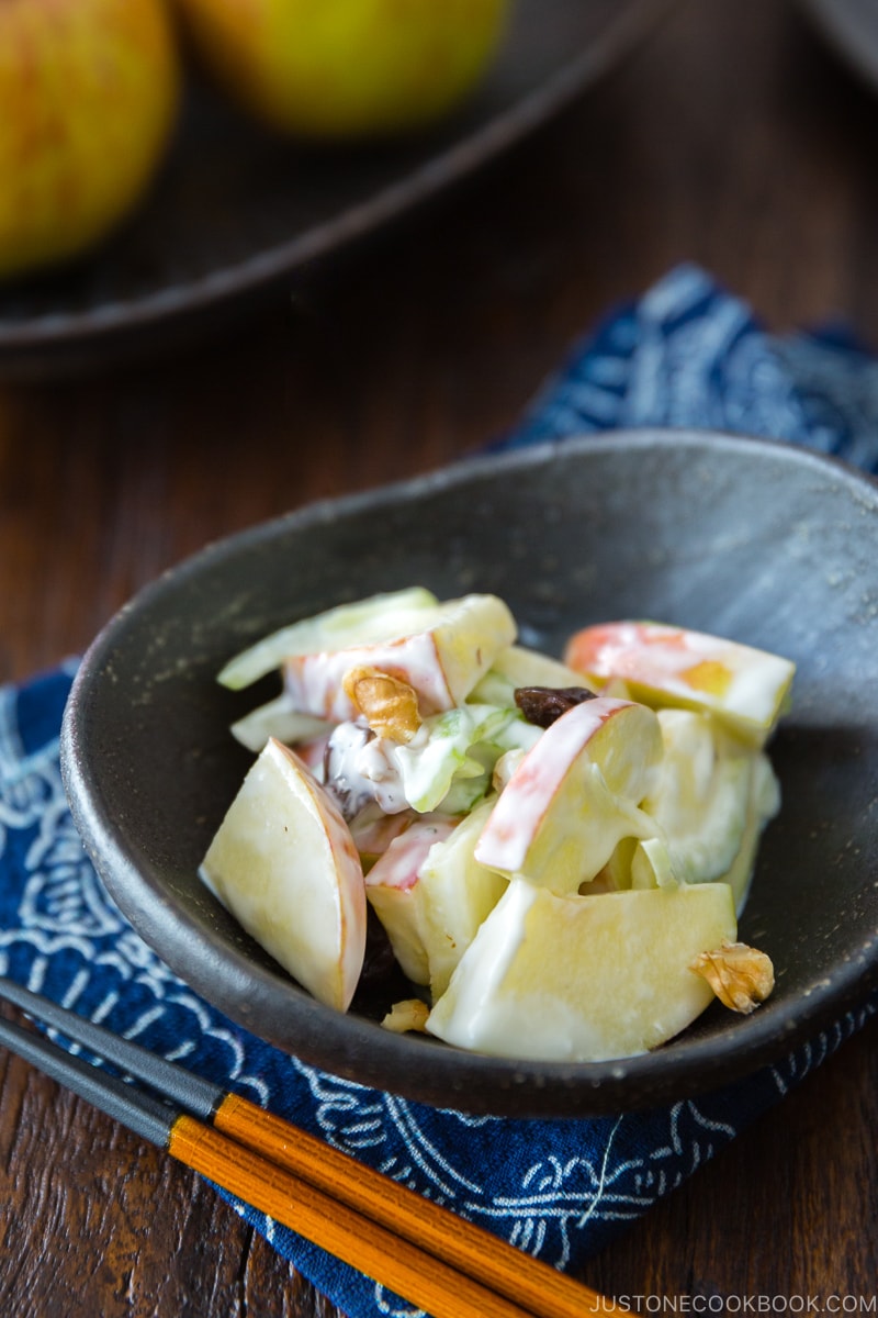 Apple Walnut Salad in a black ceramic bowl.