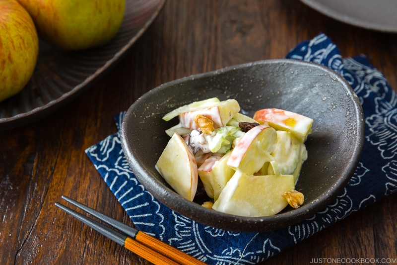 Apple Walnut Salad in a black ceramic bowl.