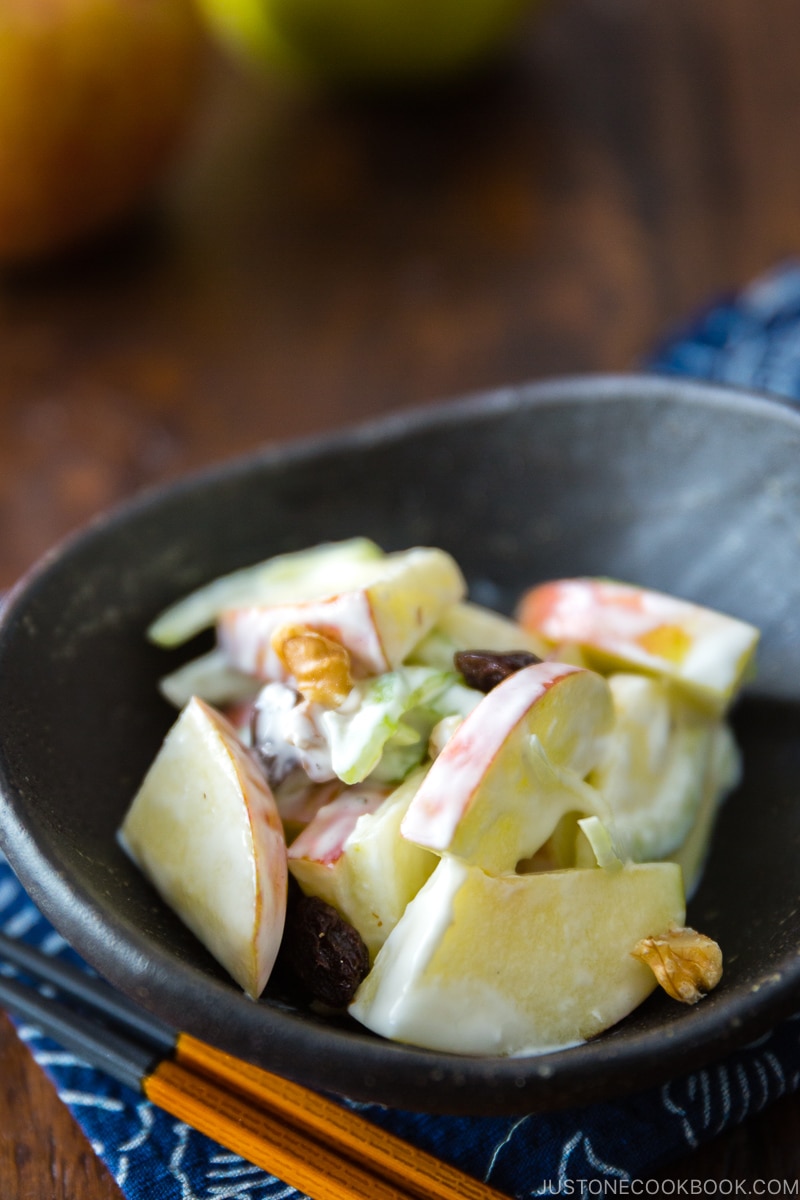 Apple Walnut Salad in a black ceramic bowl.