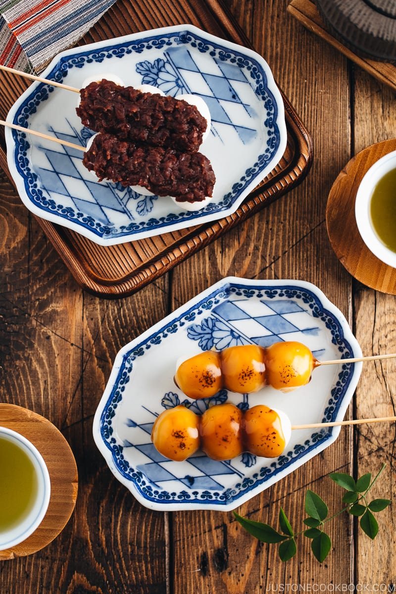 Mitarashi Dango and Dango with anko on a Japanese blue ceramic.