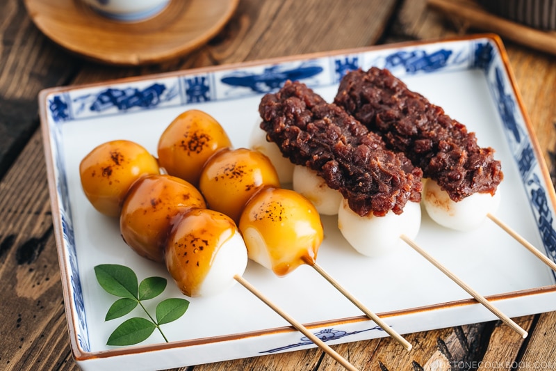 Mitarashi Dango and Dango with anko on a Japanese blue ceramic.