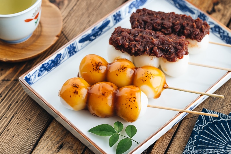 Mitarashi Dango and Dango with anko on a Japanese blue ceramic.