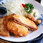 Ham Katsu served with Japanese potato salad and shredded cabbage.