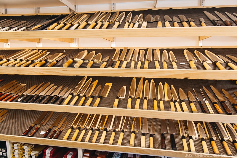 Kikuichi knives displayed on a shelf - Your Guide to Japanese Knives | www.justonecookbook.com