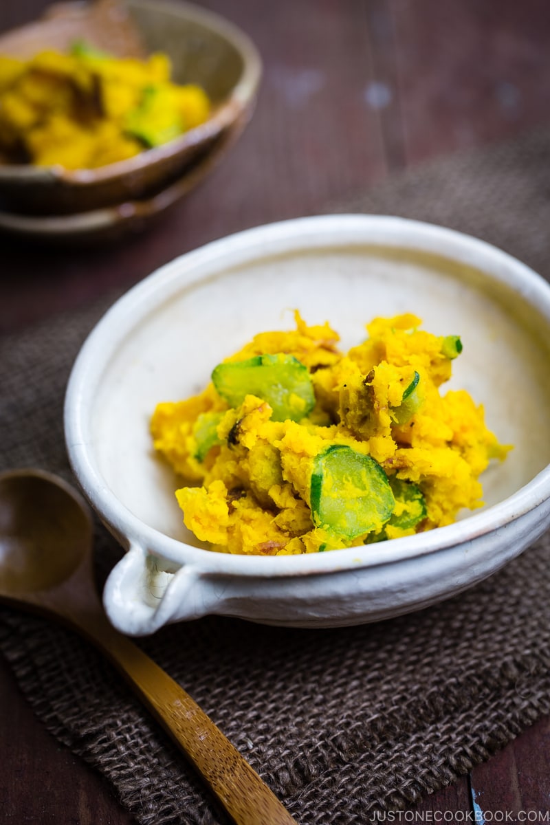 Kabocha salad in a white Japanese ceramic bowl.