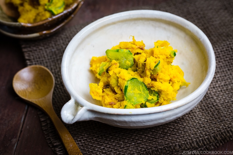 Kabocha salad in a white Japanese ceramic bowl.