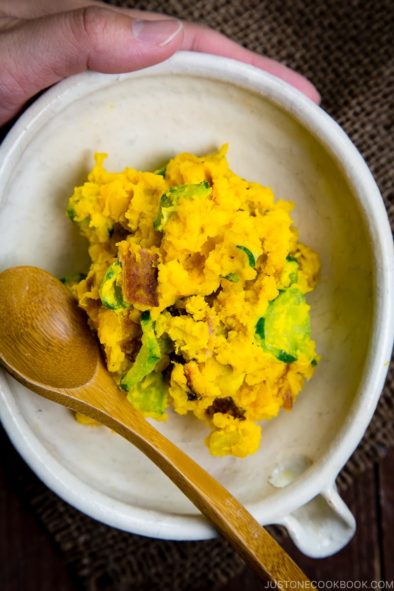 Kabocha salad in a white Japanese ceramic bowl.