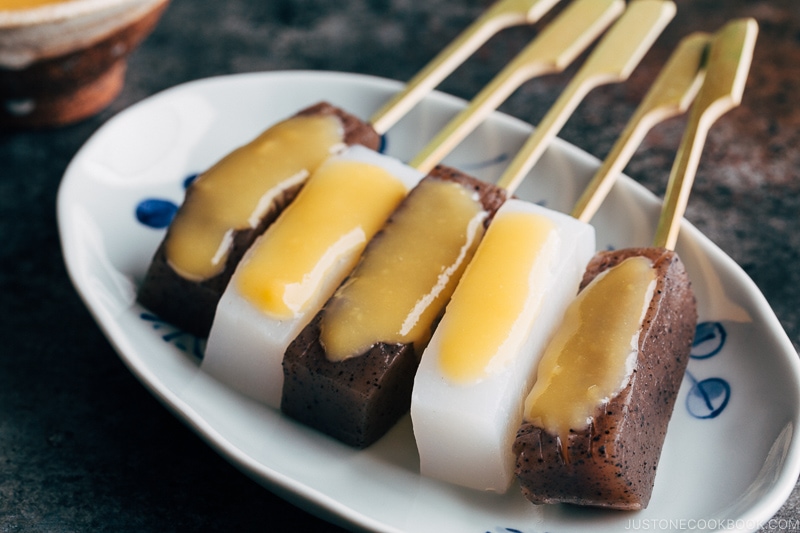 Skewered konnyaku dengaku on a plate.