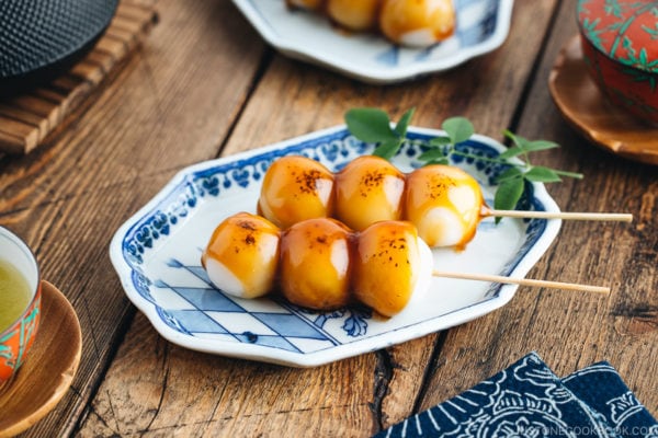 Mitarashi Dango on a blue plate.