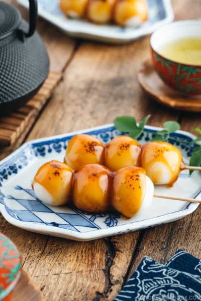 Mitarashi Dango on a blue plate.