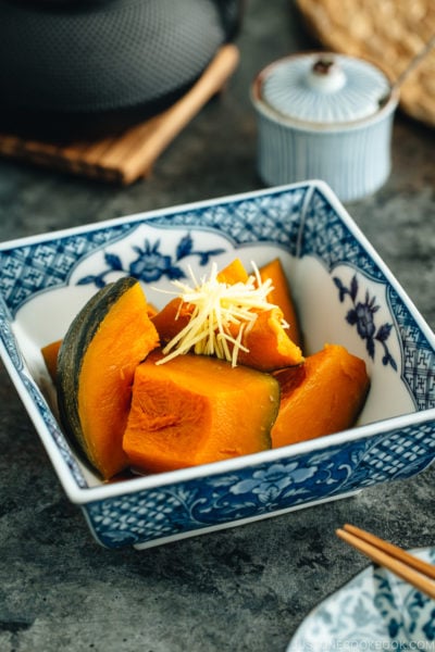 Simmered Kabocha Squash in a Japanese square bowl.