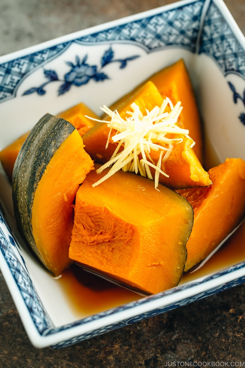 Simmered Kabocha Squash in a Japanese square bowl.