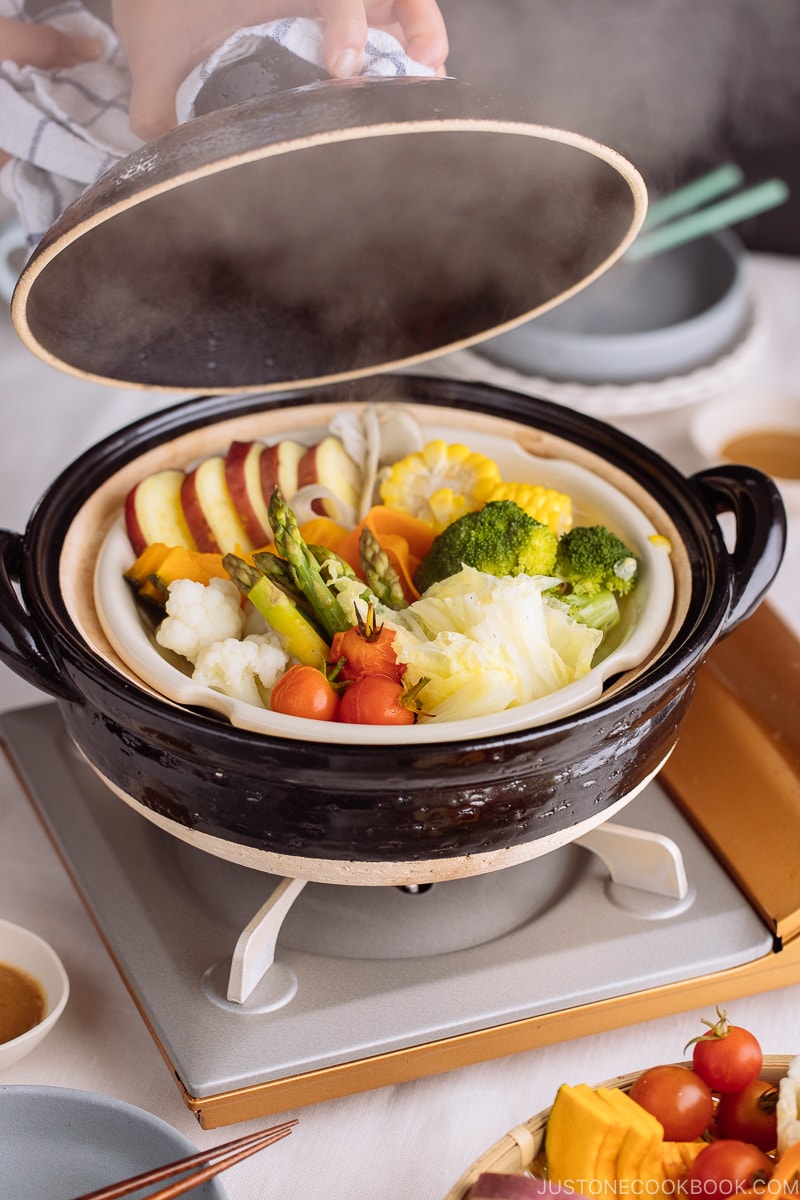 Japanese donabe containing steamed vegetables.