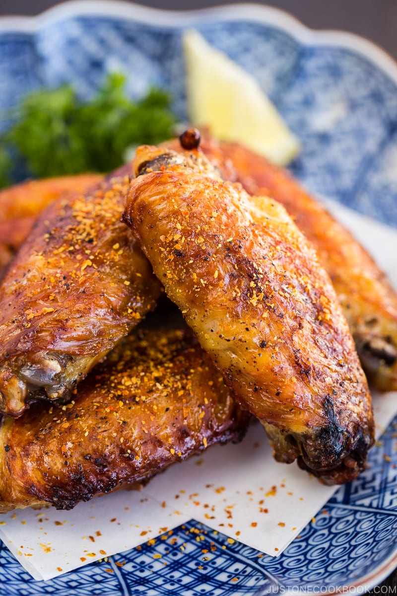 Japanese Salted Chicken Wings (Teba Shio) with sprinkle of shichimi togarashi on the Japanese plate.