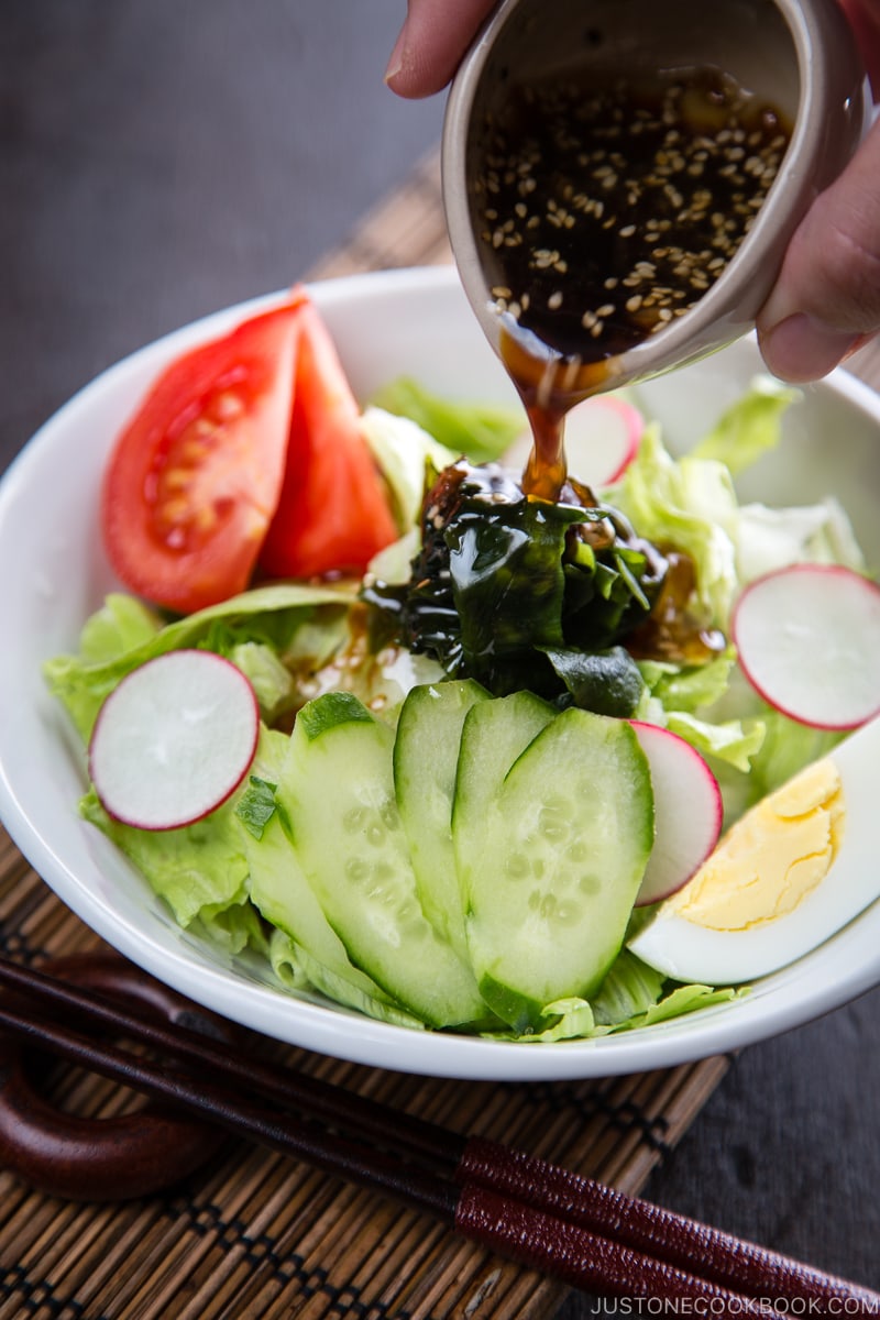 Japanese salad dressing (Wafu Dressing) over the iceberg salad.
