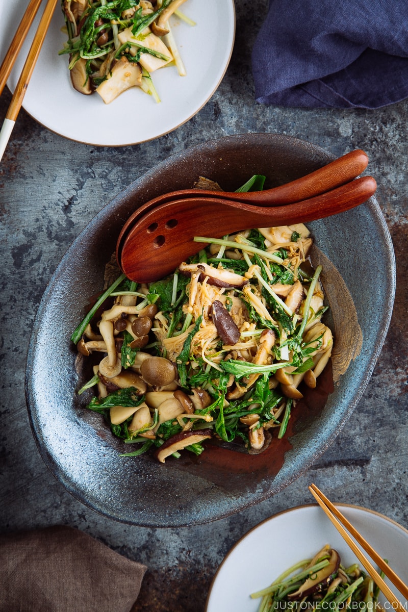 Warm Mushroom Salad with Sesame Dressing in a dark ceramic bowl.