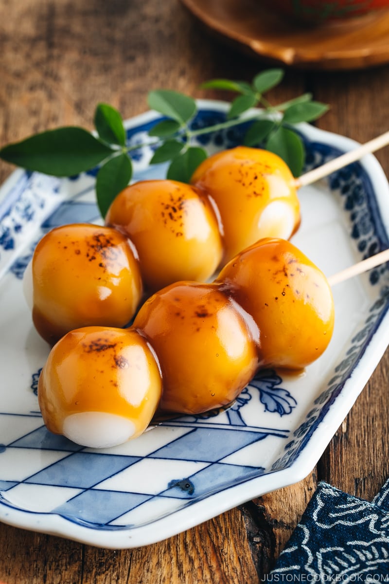 Mitarashi Dango on a blue plate.