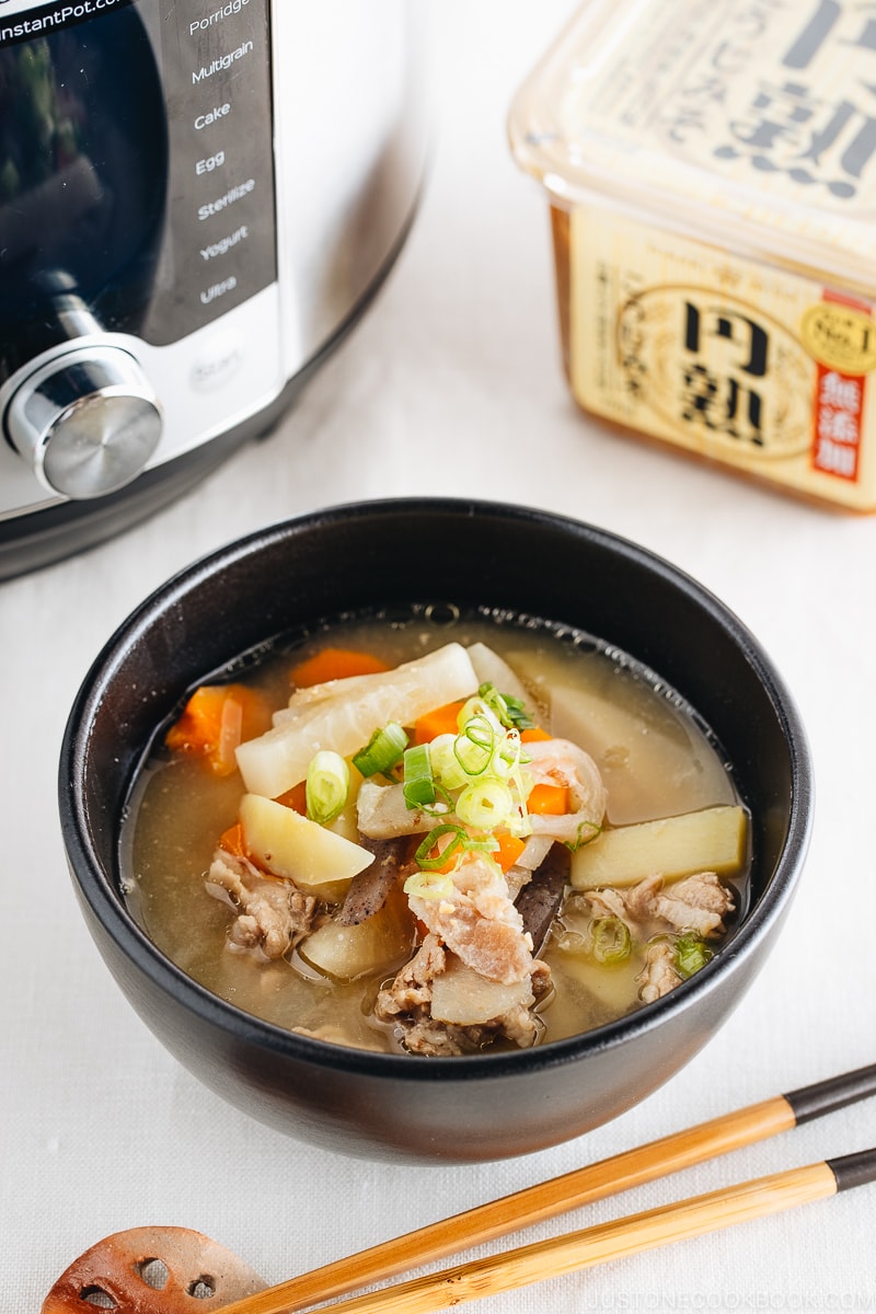 Tonjiru served in a black bowl.