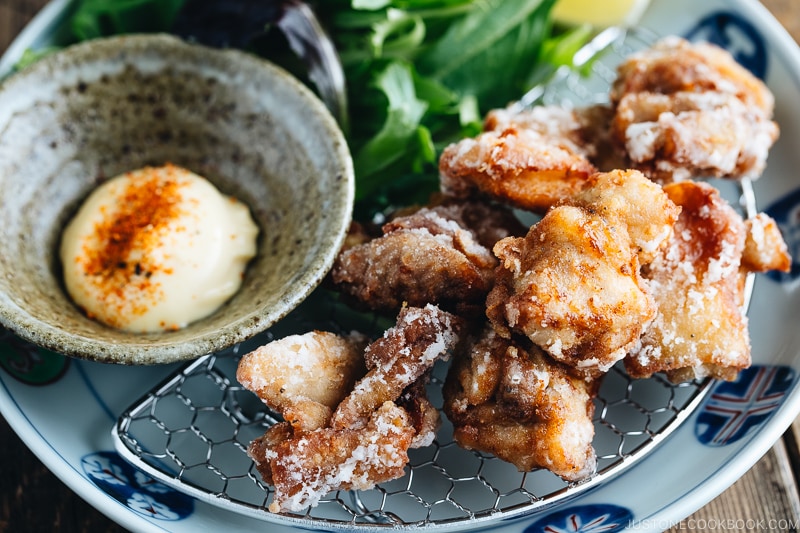 Karaage (Japanese Fried Chicken) on a Japanese plate, served with Japanese mayo.