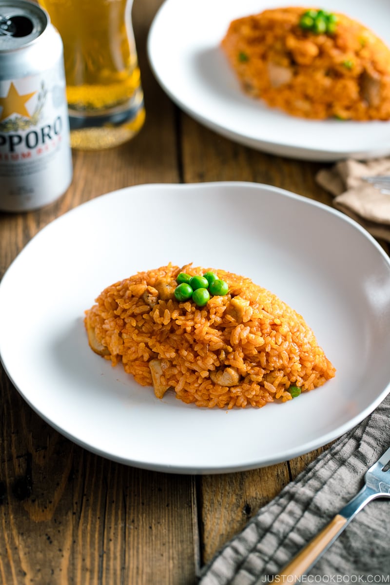 A football-shaped Chicken fried rice served on a plate