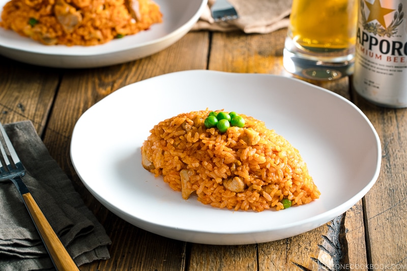 A football-shaped Chicken fried rice served on a plate