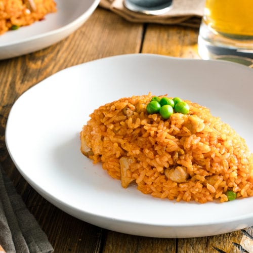 A football-shaped Chicken fried rice served on a plate