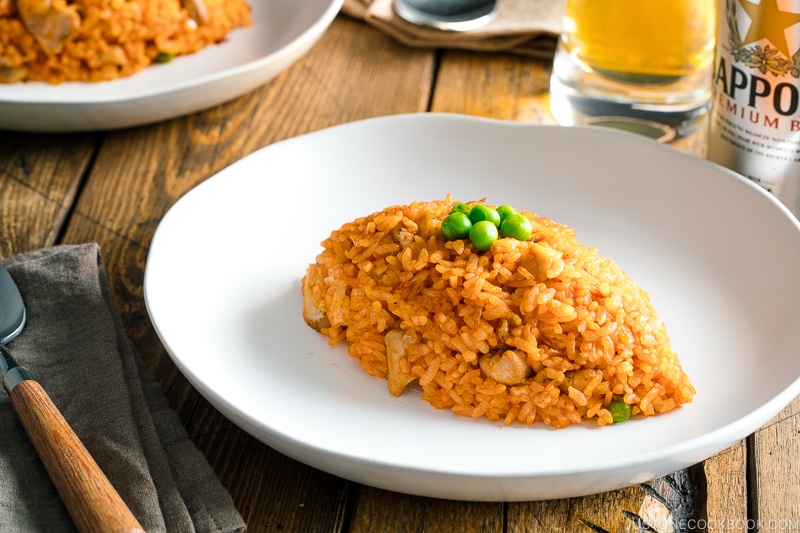 A football-shaped Chicken fried rice served on a plate