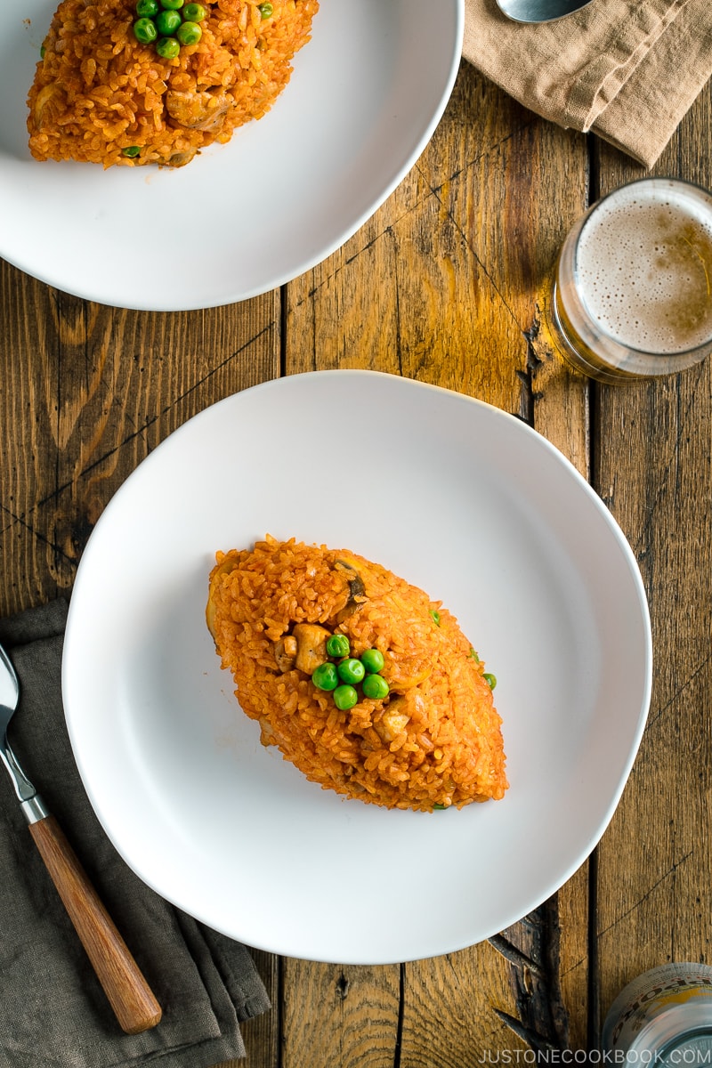 A football-shaped Chicken fried rice served on a plate