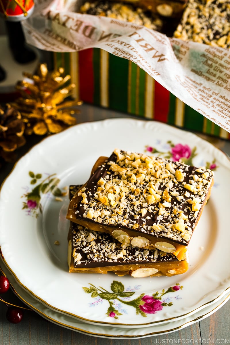 Small plates with flower pattern containing Chocolate Almond Toffee.